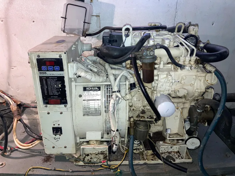 Slide: The Image of Kohler marine generator in a 1976 Hatteras 46 yacht engine room. - 68