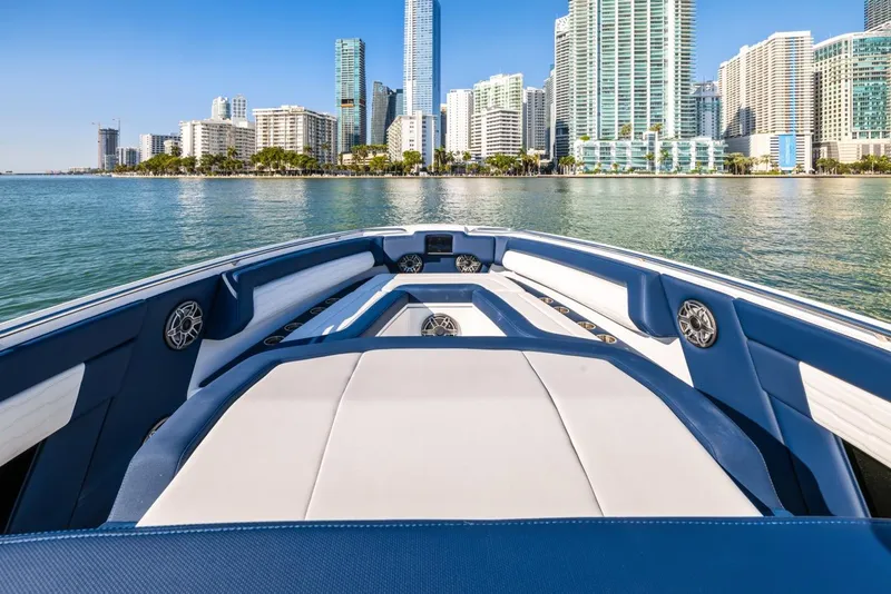 Slide: The Image of 2023 Cigarette 42 Auroris boat with city skyline in the background. - 13