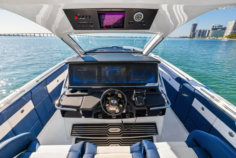 Slide: The Image of 2023 Cigarette 42 Auroris boat cockpit with modern navigation system and luxurious seating. - 21