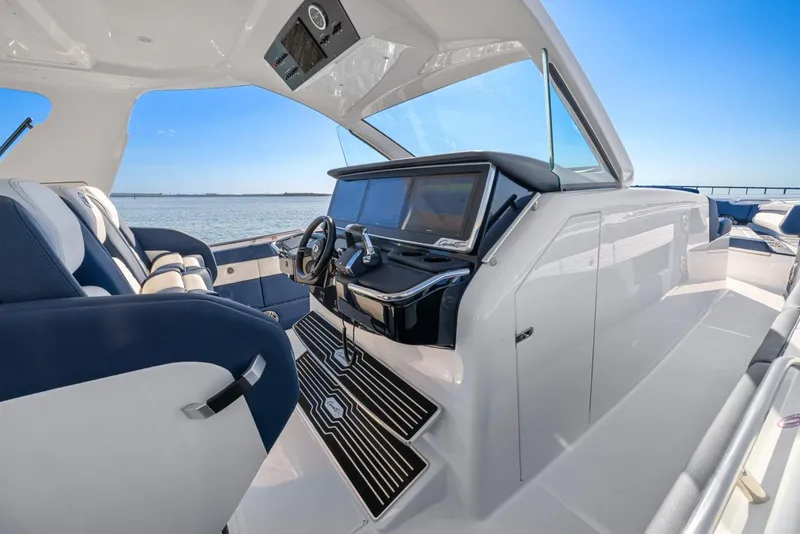 Slide: The Image of 2023 Cigarette 42 Auroris luxury boat interior with modern dashboard and seating. - 26