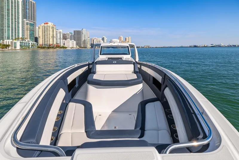 Slide: The Image of 2023 Cigarette 42 Auroris boat on water with city skyline in background. - 27