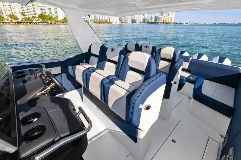 Slide: The Image of Luxurious 2023 Cigarette 42 Auroris boat interior with plush seating and scenic waterfront view. - 29