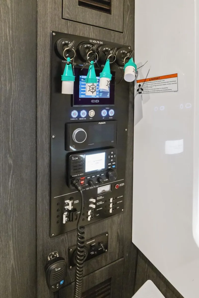 Slide: The Image of Control panel of 2023 Cigarette 42 Auroris boat with various switches and displays. - 33