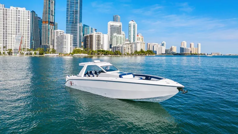 Slide: The Image of 2023 Cigarette 42 Auroris boat cruising near city skyline on a sunny day. - 8