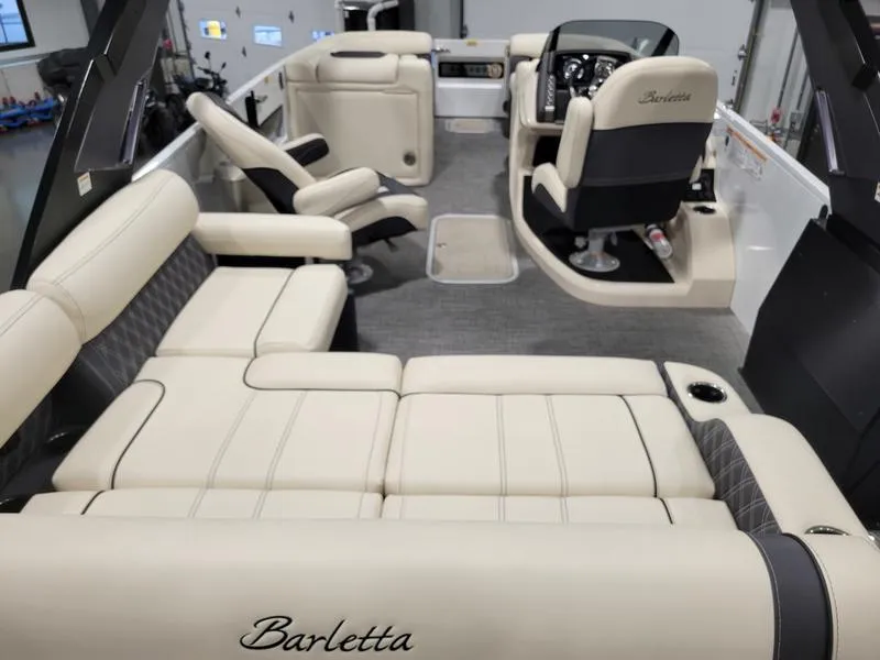 Slide: The Image of 2024 Barletta LEGGERA R26UCA boat interior with luxurious beige seating and modern design. - 15
