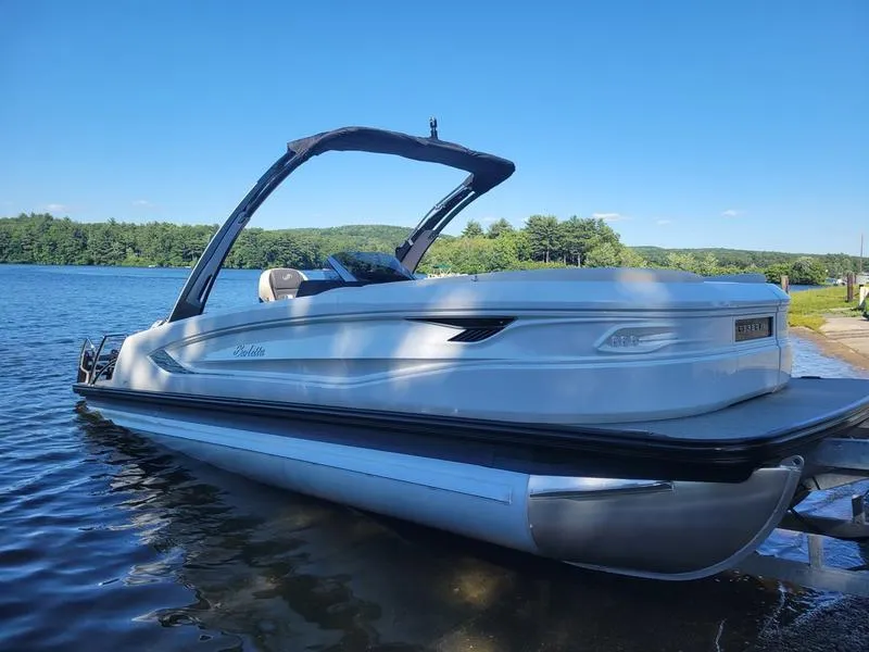 Slide: The Image of 2024 Barletta LEGGERA R26UCA pontoon boat on a serene lake. - 20