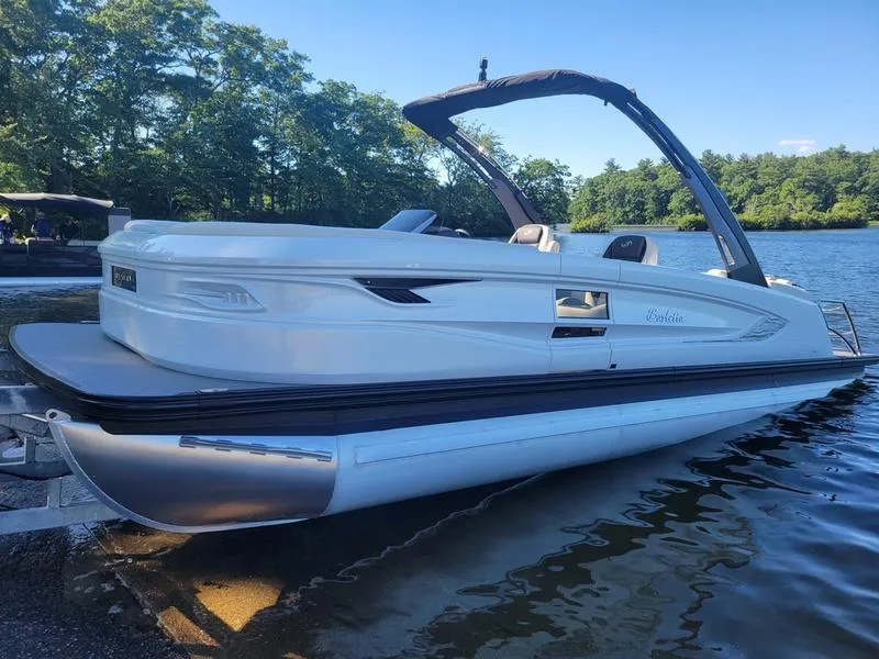 Slide: The Image of 2024 Barletta LEGGERA R26UCA pontoon boat on a serene lake. - 23