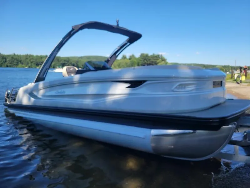 Slide: The Image of 2024 Barletta LEGGERA R26UCA pontoon boat on a serene lake. - 24