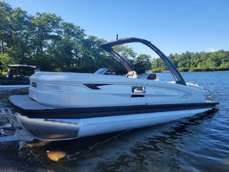 Slide: The Image of 2024 Barletta LEGGERA R26UCA pontoon boat on a serene lake. - 25