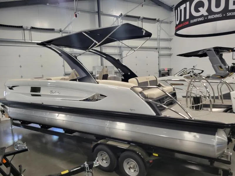 Slide: The Image of 2024 Barletta LEGGERA R26UCA pontoon boat in showroom on trailer. - 5