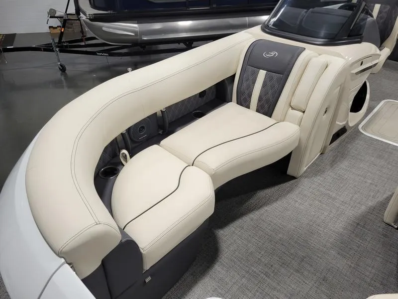 Slide: The Image of 2024 Barletta LEGGERA R26UCA boat interior with luxurious cream seating and modern design. - 8