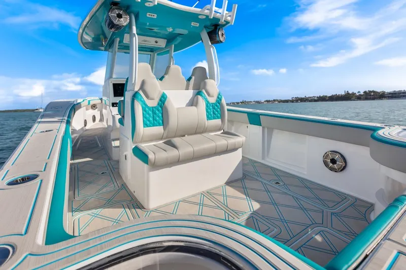 Slide: The Image of 2025 Streamline 35 CC boat with modern seating and sleek design on open water. - 20