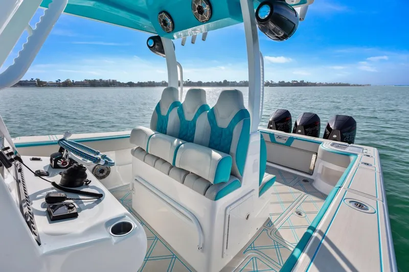 Slide: The Image of Streamline 35 CC 2025 boat interior with seating and controls on open water. - 23
