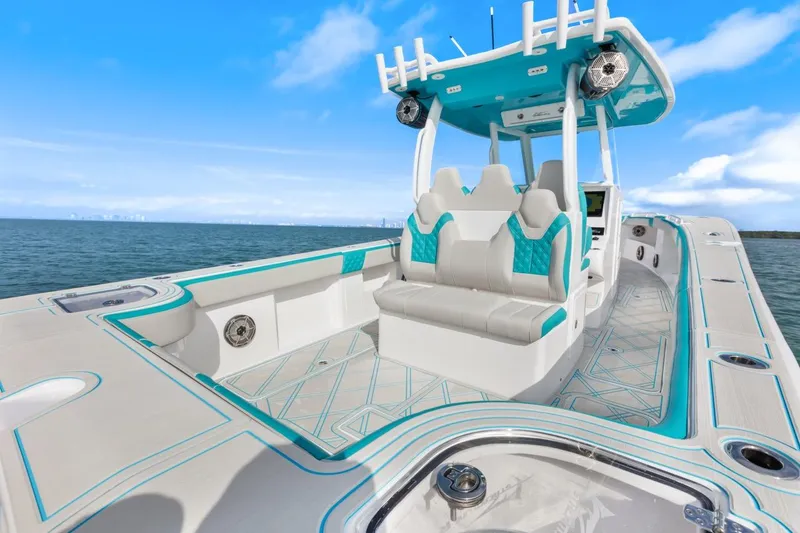 Slide: The Image of 2025 Streamline 35 CC boat with modern seating and ocean backdrop. - 29