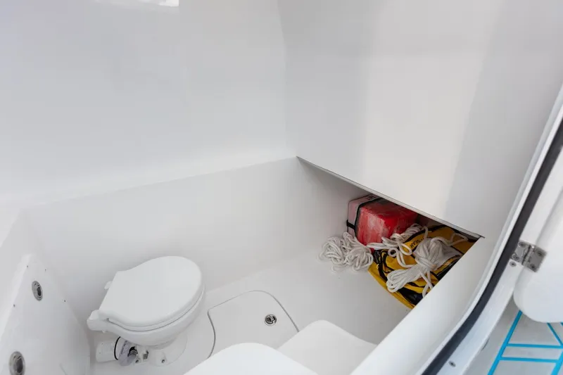 Slide: The Image of 2025 Streamline 35 CC boat interior with toilet and storage area. - 31