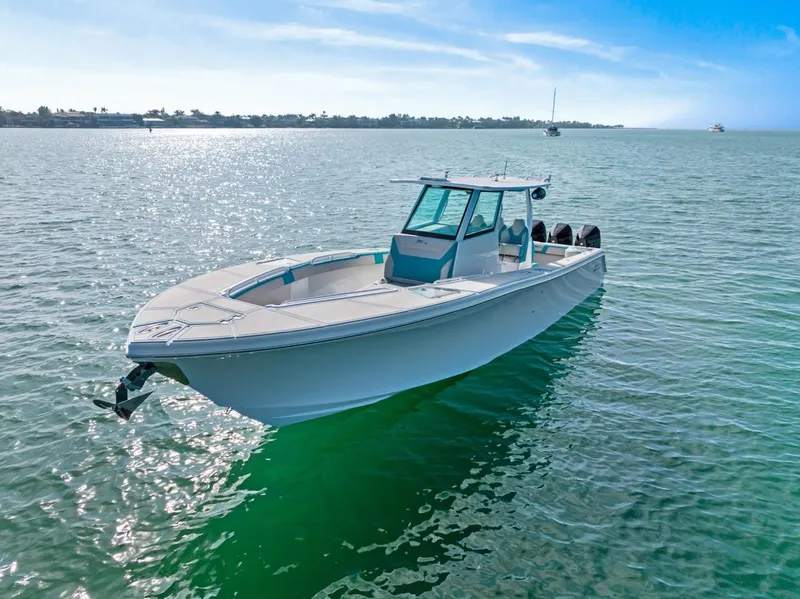 Slide: The Image of 2025 Streamline 35 CC boat on calm ocean waters under clear blue sky. - 4