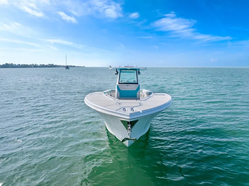 Slide: The Image of 2025 Streamline 35 CC boat on calm ocean under clear blue sky. - 7