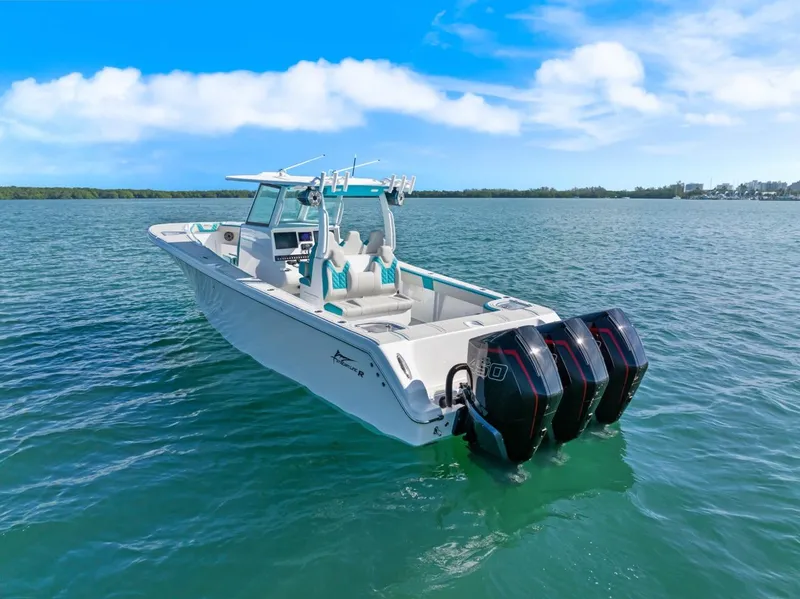 Slide: The Image of 2025 Streamline 35 CC boat on open water with triple engines. - 9