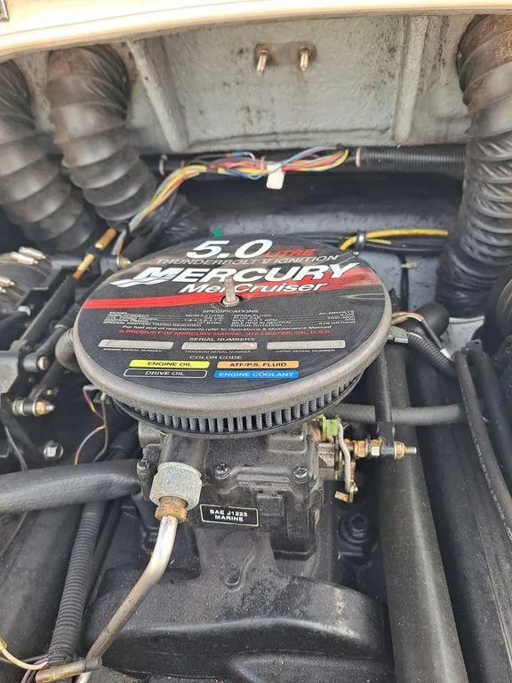 Slide: The Image of 2003 Bayliner 205 Olympic Edition engine, featuring a 5.0 Mercury MerCruiser. - 13