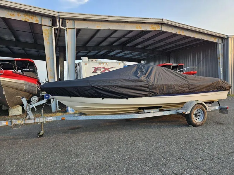 Slide: The Image of Covered 2003 Bayliner 205 Olympic Edition boat on trailer in storage facility. - 5