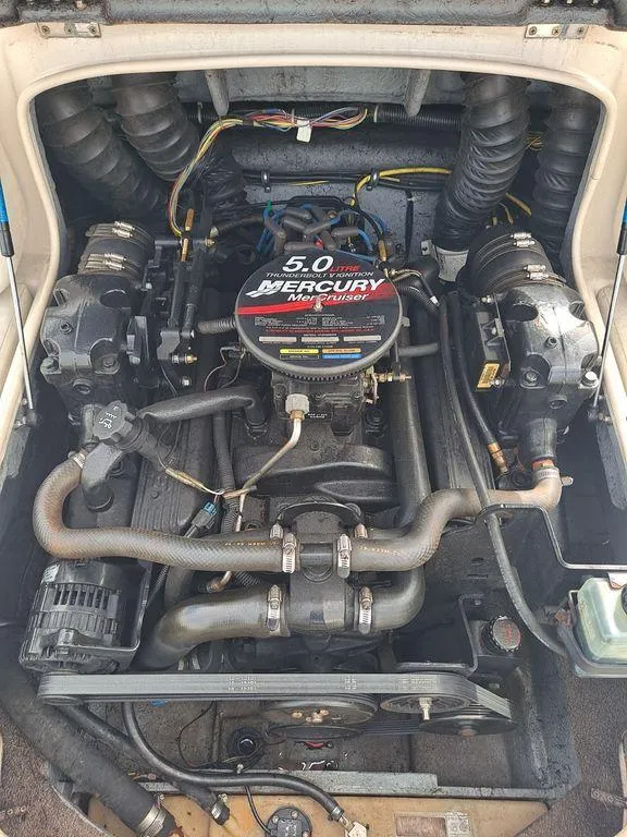 Slide: The Image of 2003 Bayliner 205 Olympic Edition boat engine, featuring a 5.0 Mercury motor. - 8