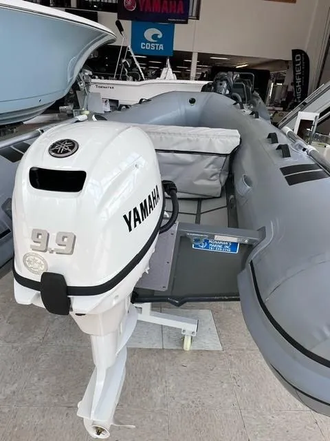 Slide: The Image of 2023 Highfield Ultralite 310 boat with Yamaha 9.9 outboard motor in showroom. - 3