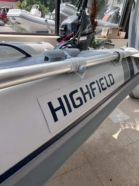 Slide: The Image of 2023 Highfield Classic 290 boat, close-up view of branding and design. - 2