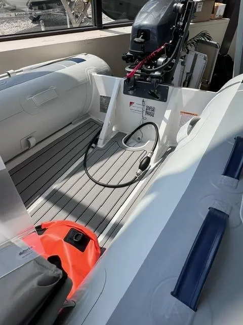 Slide: The Image of 2023 Highfield Classic 290 inflatable boat interior with motor and accessories. - 3