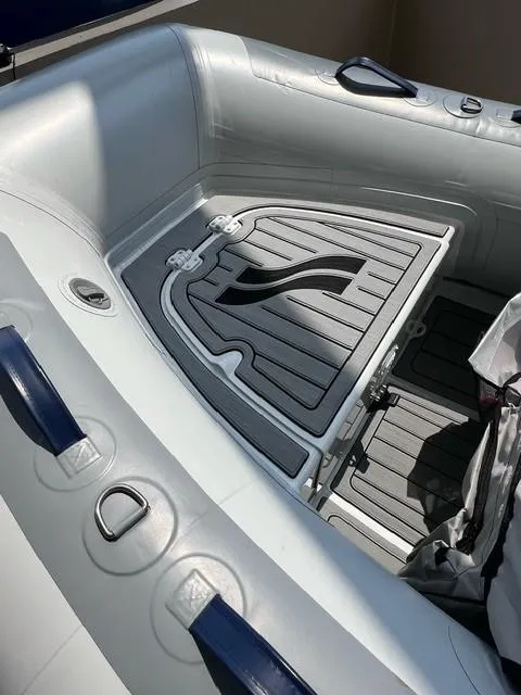 Slide: The Image of 2023 Highfield Classic 290 inflatable boat interior with gray seating and floor design. - 4