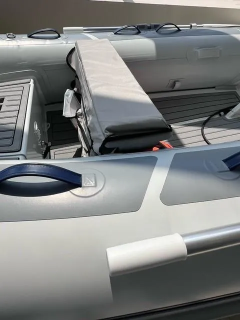 Slide: The Image of 2023 Highfield Classic 290 inflatable boat interior with seating and storage. - 5