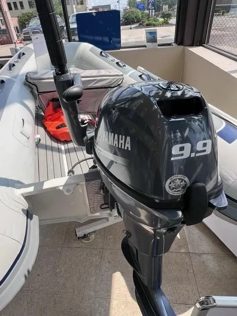 Slide: The Image of 2023 Highfield Classic 290 boat with Yamaha 9.9 outboard motor in showroom. - 6