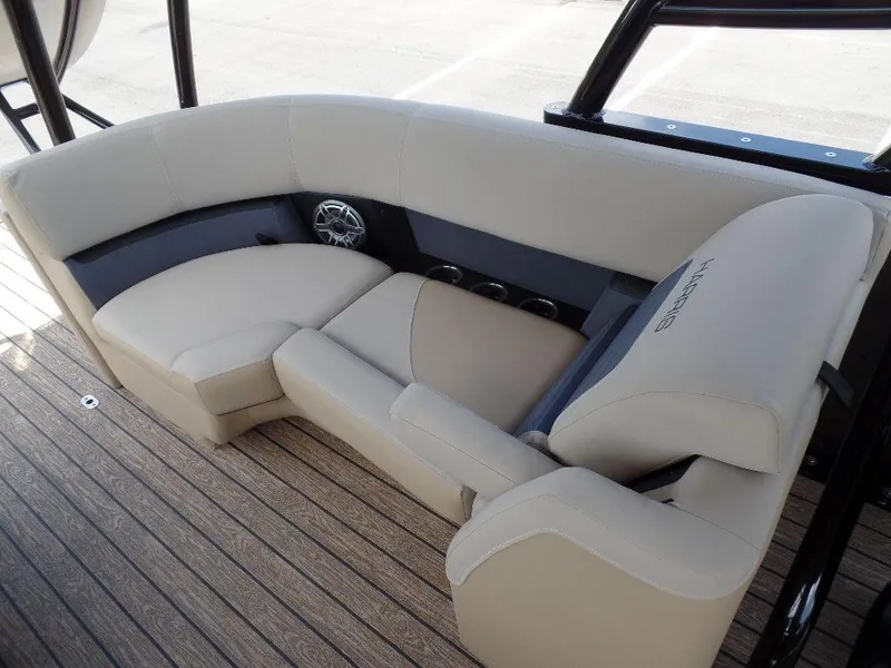 Slide: The Image of 2025 Harris Solstice 270 REC boat seating with beige upholstery and wood flooring. - 14