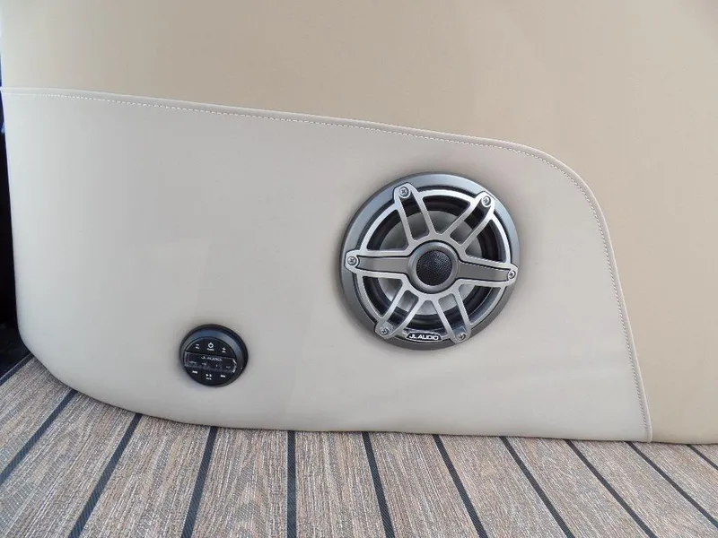 Slide: The Image of 2025 Harris Solstice 270 REC boat speaker and control panel on beige interior. - 15