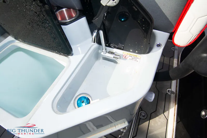 Slide: The Image of 2024 Glasstream 32 GSX boat sink and storage area with modern design. - 13