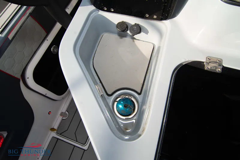 Slide: The Image of 2024 Glasstream 32 GSX boat interior detail with control panel and cup holder. - 15