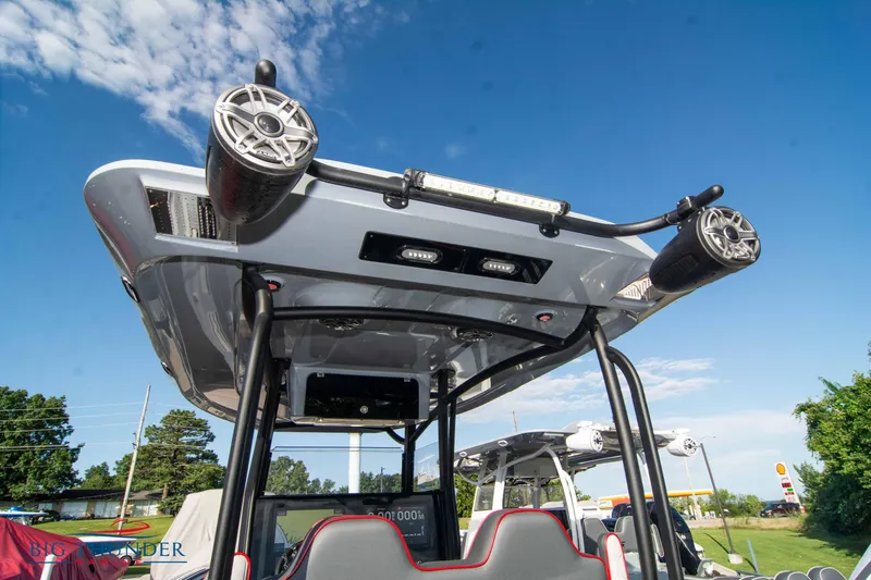 Slide: The Image of 2024 Glasstream 32 GSX boat with advanced audio system and sleek design under a clear sky. - 16