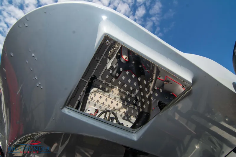 Slide: The Image of 2024 Glasstream 32 GSX boat hull with visible internal components, under a blue sky. - 18