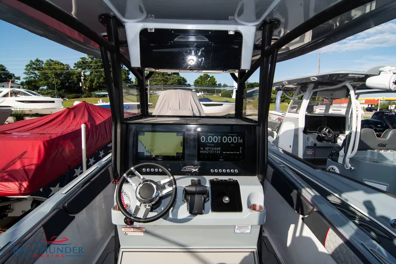 Slide: The Image of 2024 Glasstream 32 GSX boat dashboard with modern controls and navigation system. - 22