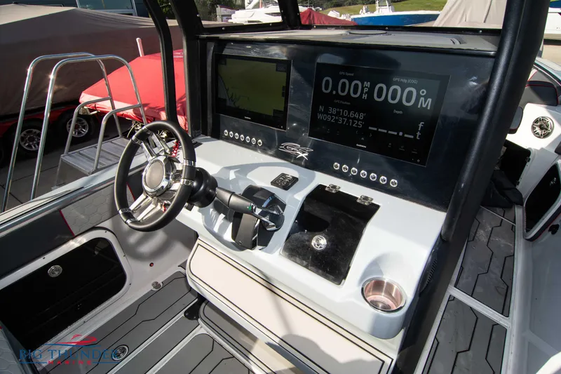 Slide: The Image of 2024 Glasstream 32 GSX boat dashboard with modern controls and digital displays. - 25