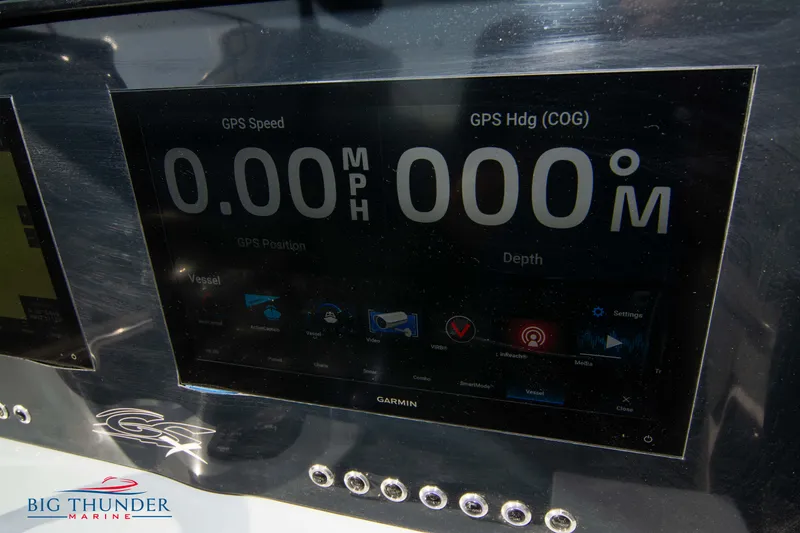 Slide: The Image of Garmin GPS display on 2024 Glasstream 32 GSX boat dashboard, showing speed and heading. - 29