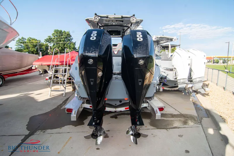 Slide: The Image of 2024 Glasstream 32 GSX boat with dual Mercury outboard engines, parked outdoors. - 3