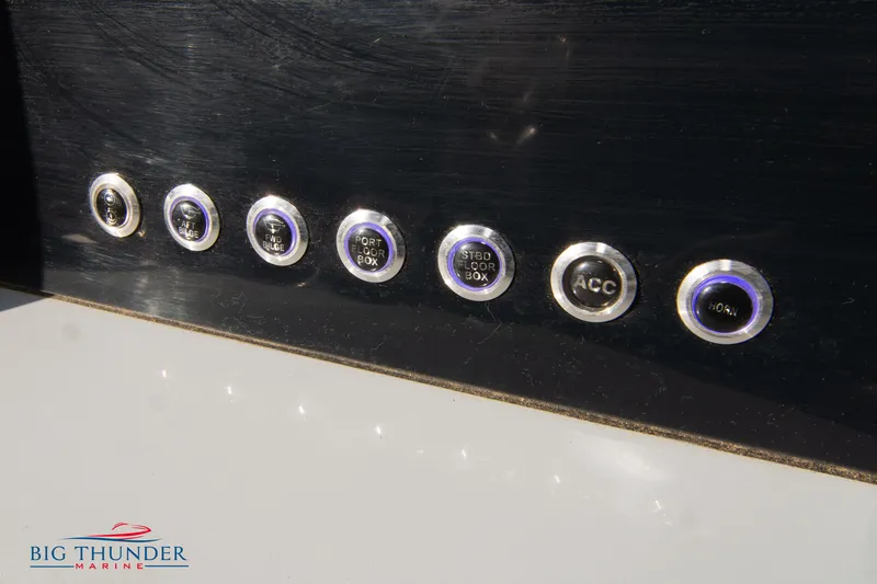 Slide: The Image of Control panel buttons on 2024 Glasstream 32 GSX boat dashboard. - 30