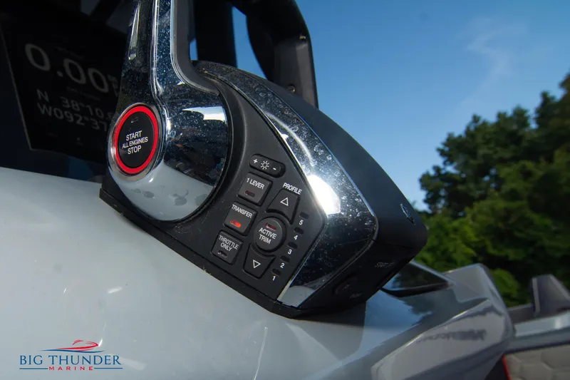 Slide: The Image of Close-up of 2024 Glasstream 32 GSX boat controls with start/stop button. - 35