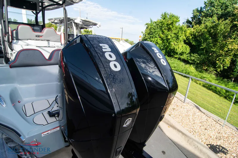 Slide: The Image of 2024 Glasstream 32 GSX with twin Mercury 300 engines, parked outdoors. - 4