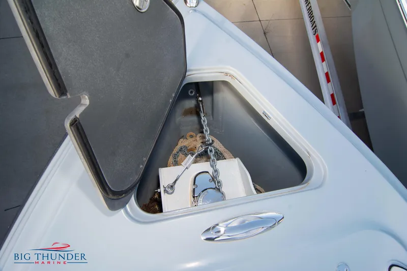 Slide: The Image of 2024 Glasstream 32 GSX anchor compartment with chain and storage. - 46