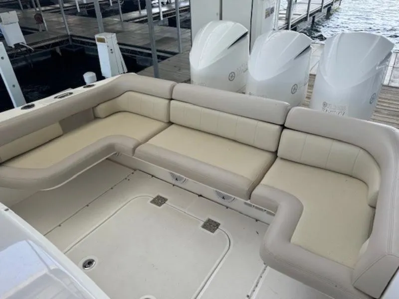 Slide: The Image of Luxurious seating area on a 2016 Everglades 360LXC boat with triple outboard engines. - 13