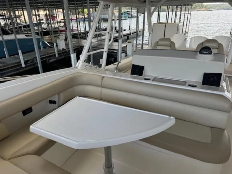 Slide: The Image of Interior of 2016 Everglades 360LXC boat with seating and table. - 17