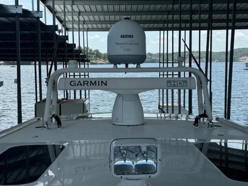 Slide: The Image of 2016 Everglades 360LXC boat with Garmin xHD2 radar and TracVision system in marina. - 19