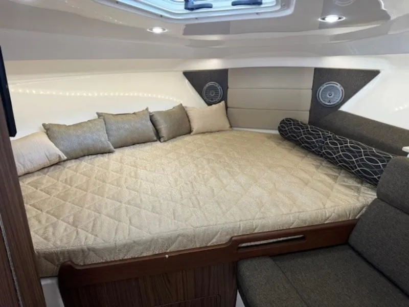 Slide: The Image of Luxurious cabin interior of 2016 Everglades 360LXC with plush bedding and modern design. - 27