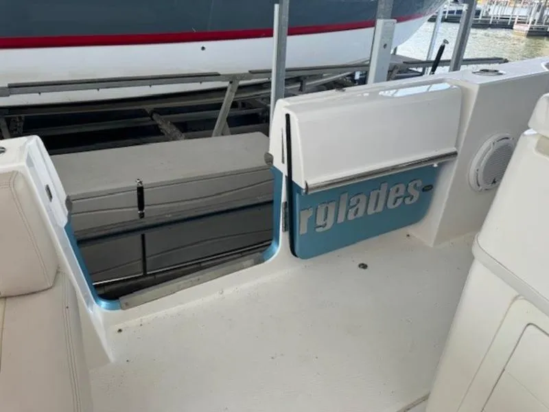 Slide: The Image of 2016 Everglades 360LXC boat interior with open side door. - 28